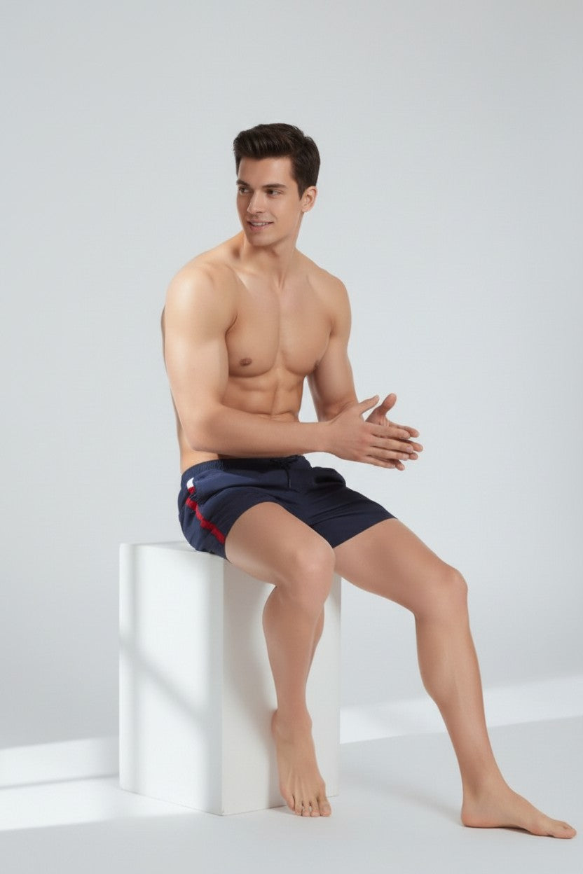 Christian Audigier Deep Solid Blue Low Waist Swim Shorts with Side Stripes. BMS6190007M