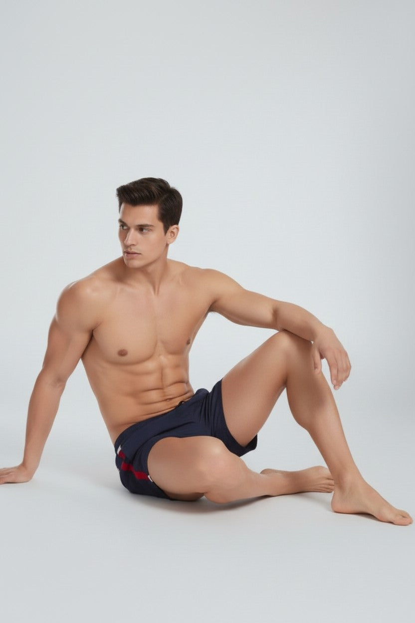 Christian Audigier Deep Solid Blue Low Waist Swim Shorts with Side Stripes. BMS6190007M